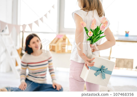 Tulips and gift box from daughter for happy mother 107468356
