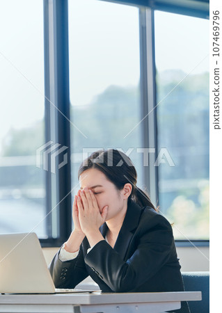Young woman thinking at work Young woman thinking at work 107469796