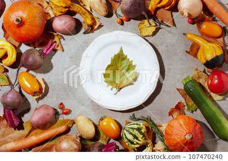 autumn flat lay on concrete background with pumpkins 107470240