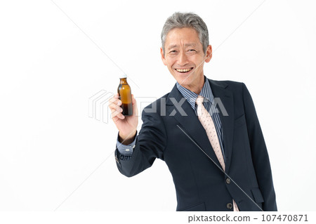 Senior man with energy drink 107470871