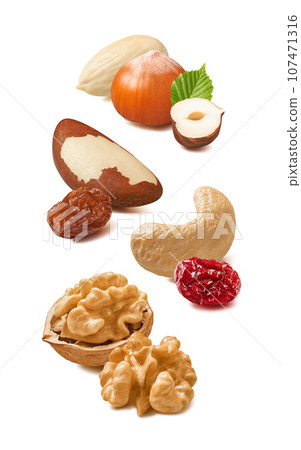 Blanched almond, hazelnut, cashew, walnut, brazil nut, cranberry, raisin isolated on white Blanched almond, hazelnut, cashew, walnut, brazil nut, cranberry, raisin isolated on white 107471316
