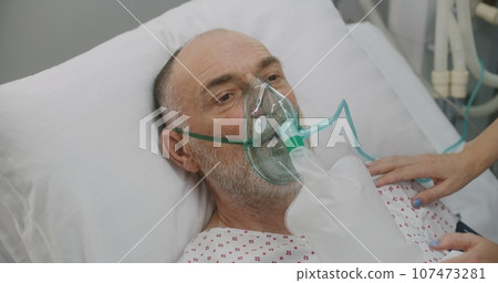 Nurse takes care of sick senior patient in hospital Nurse takes care of sick senior patient in hospital 107473281