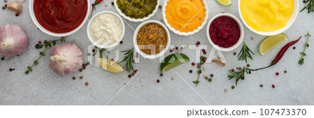 Different types of sauces in bowls 107473370