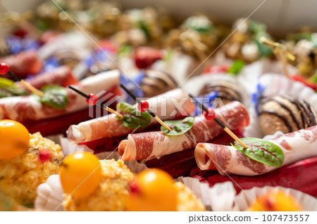 Catering service. Set of beautiful canapes. Buffet table. Shallow depth of view. 107473557