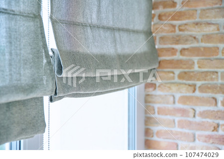 Close-up of roman blinds with gray linen fabric 107474029