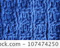Dark blue handmade knitting blanket background. 107474250