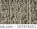 Dark brown handmade knitting blanket background. 107474251
