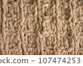 Yellow handmade knitting blanket background. 107474253