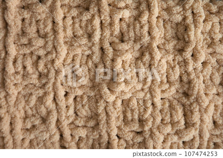 Yellow handmade knitting blanket background. Yellow handmade knitting blanket background. 107474253