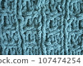 Light blue handmade knitting blanket background. 107474254
