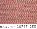 Light salmon pink handmade knitting blanket background. 107474255