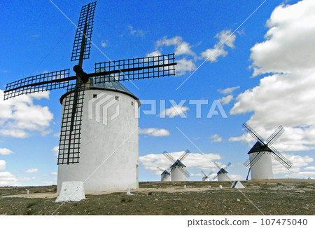 Spain, La Mancha, blue sky and white windmill 107475040