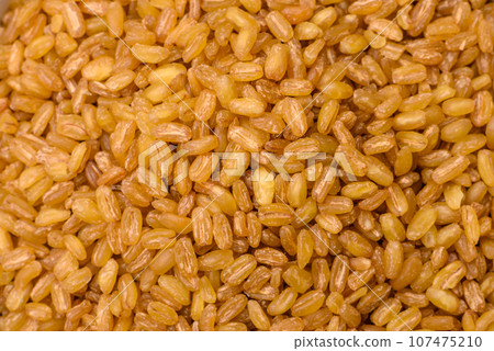 Raw bulgur wheat porridge as an ingredient for preparing a delicious dish Raw bulgur wheat porridge as an ingredient for preparing a delicious dish 107475210
