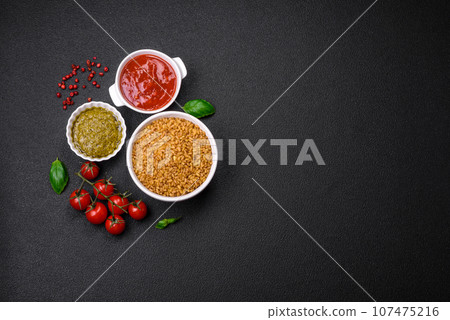 Raw bulgur wheat porridge as an ingredient for preparing a delicious dish 107475216