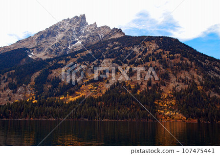 Grand Teton National Park in autumn, United States, Teton Mountains seen from Jenny Lake Shuttle Boat Grand Teton National Park in autumn, United States, Teton Mountains seen from Jenny Lake Shuttle Boat 107475441