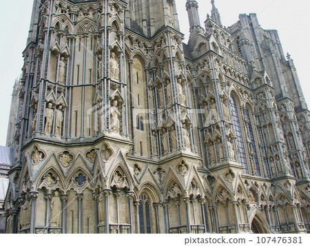 United Kingdom, England, Somerset, Wells Cathedral, niche with royal statues on the buttress on the north side of the west facade United Kingdom, England, Somerset, Wells Cathedral, niche with royal statues on the buttress on the north side of the west facade 107476381