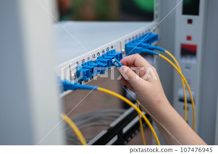 child's hand plugs the cable into the connector. Training stand at an 107476945