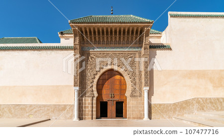 Traditional Moroccan door with Islamic design. Geometric shapes and floral motifs are common, with a piece of culture and history. Traditional Moroccan door with Islamic design. Geometric shapes and floral motifs are common, with a piece of culture and history. 107477716