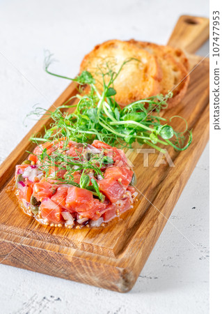 Portion of salmon tartare Portion of salmon tartare 107477953