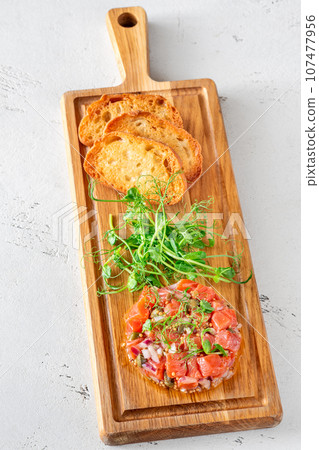 Portion of salmon tartare Portion of salmon tartare 107477956