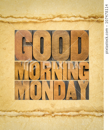 Good Morning Monday word abstract in letterpress wood type against art paper, starting a new work week concept 107478114