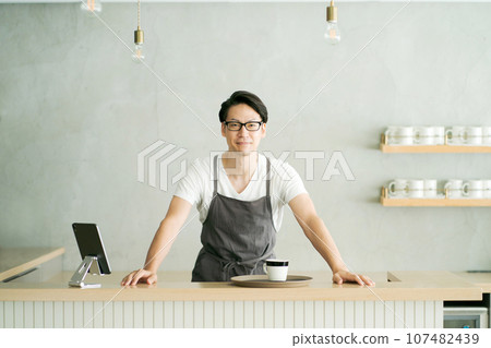 A man working at a cafe 107482439