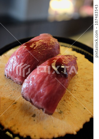 Omihachiman specialty Omi beef nigiri with sweet and spicy sauce and shrimp crackers 107483543