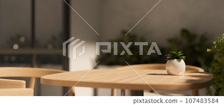 Close-up image of a copy space on a wooden table in a minimalist and cosy coffee shop. Close-up image of a copy space on a wooden table in a minimalist and cosy coffee shop. 107483584