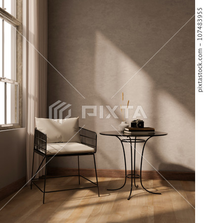 A cozy minimalist living room with an armchair by the window, a table, and a parquet floor. 107483955