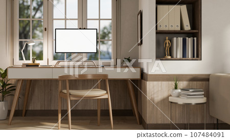 A modern minimalist Scandinavian home office workspace with a computer on a wooden table. A modern minimalist Scandinavian home office workspace with a computer on a wooden table. 107484091
