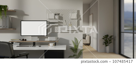 Modern minimal white home workspace with a computer on a table Modern minimal white home workspace with a computer on a table 107485417