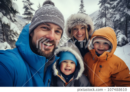 Happy family, Father, mother, daughter and son selfie together while hiking on winter high peak mountains. Family activity enjoying to travel together. Generative AI. 107488610