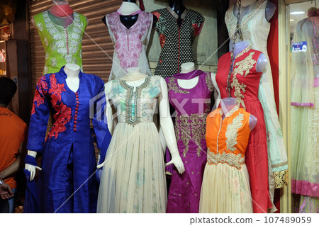 Mannequins dressed in latest Indian dresses in front of a retail cloth shop in Kolkata, India 107489059