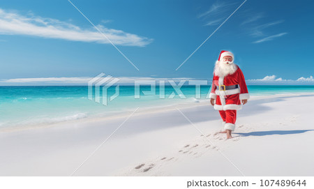 Santa Claus on the ocean shore with white sand and blue water. Merry Christmas and Happy New Year Santa Claus on the ocean shore with white sand and blue water. Merry Christmas and Happy New Year 107489644