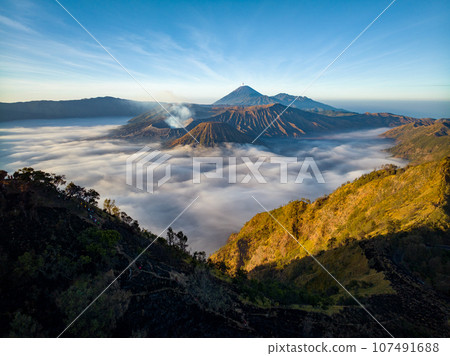 Aerial drone view of Bromo active volcano at sunrise,Tengger Semeru national park, East Java, Indonesia 107491688