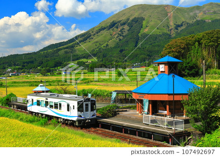[Kumamoto Prefecture] Minami Aso Railway and Mt. Aso on a sunny day (Hakusui Kogen Station) 107492697