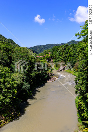Yubari City, Hokkaido, bridge over Yubari River and Takinoue Park in midsummer [August] 107492892