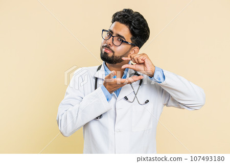 Doctor man show a little bit gesture begging help need some more please give me measuring small size 107493180