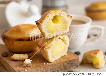 Pasticciotto leccese pastry filled with egg custard cream on a napkin close up 107493555