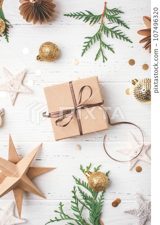 Festive Christmas background with gift box and Christmas decorations 107496320