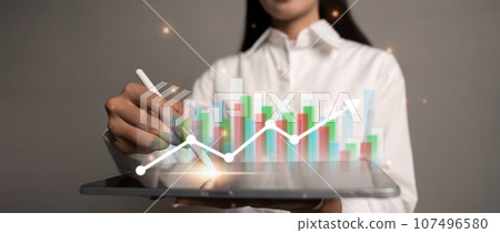 Business woman using tablet to analysis sale data and economic and technology growth graph chart on global network Business woman using tablet to analysis sale data and economic and technology growth graph chart on global network 107496580