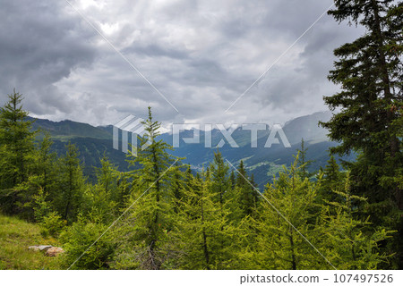 Thunderstorm clouds over the mountains 107497526