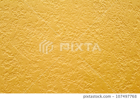 Texture of golden decorative plaster. Abstract grunge background for design. Texture of golden decorative plaster. Abstract grunge background for design. 107497768