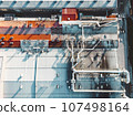 Directly above, looking down at the roof top of distribution center, and pipes going across the roof  107498164