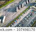Aerial view of two parking lots, one for trucks and one for cars  107498170