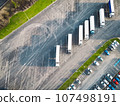 Car and truck parking lot separated, aerial view  107498191