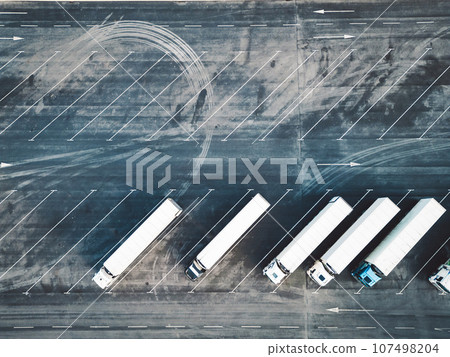 Top down view of truck parking lot at distribution center  107498204