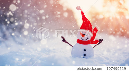 Little handmade snowman on the white snow on snowy background. Little handmade snowman on the white snow on snowy background. 107499519