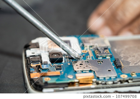 Repairing and upgrade circuit mainboard of notebook, electronic, computer hardware and technology concept. Repairing and upgrade circuit mainboard of notebook, electronic, computer hardware and technology concept. 107499708