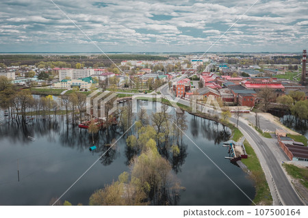 Old paper mill on banks of river big water and road Old paper mill on banks of river big water and road 107500164